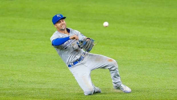 Jun 25, 2021; Arlington, Texas, USA; Kansas City Royals second baseman Whit Merrifield (15) makes a throwing error during the fourth inning against the Texas Rangers at Globe Life Field. Mandatory Credit: Andrew Dieb-USA TODAY Sports